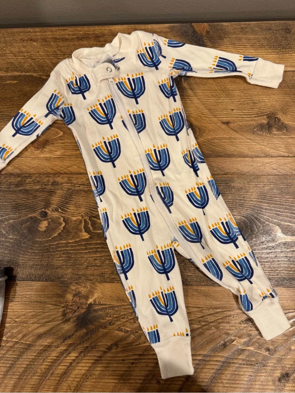 Hanna Andersson Cream Footie Pajamas with Blue & Yellow Menorah Print